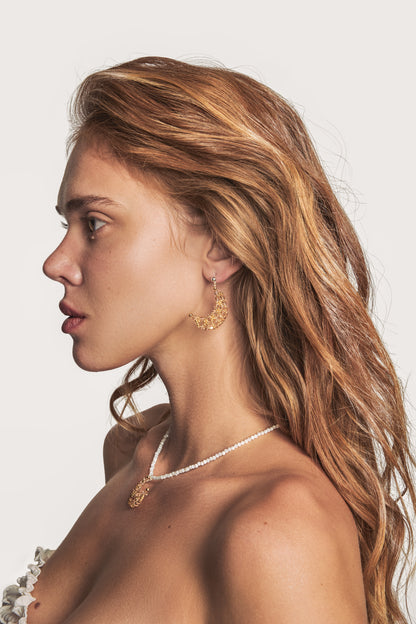 Gold-toned hoop constellation earrings with small dangling star charms