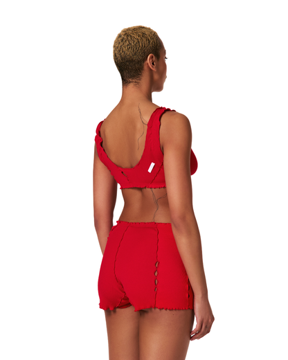 Red ribbed bralette top back view with thin straps and stitched neckline details