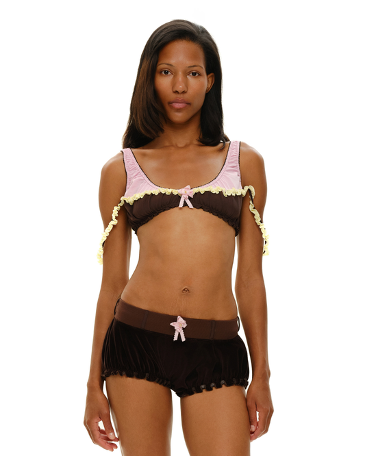 Ruffled lingerie bra with dark brown cups, pink trim, and scalloped edges