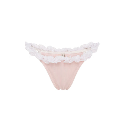 Pink ribbed tanga underwear with white ruffle trim along waistband and leg openings