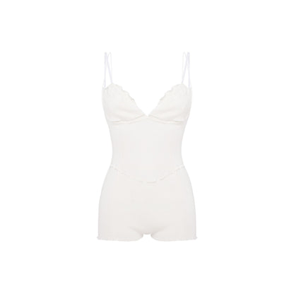 White layered bodysuit with underwire cups, thin straps, and short bottoms