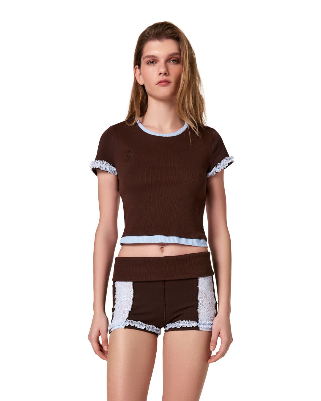 Brown cropped t-shirt worn by model with light blue ribbed trim and lace-trim sleeves.