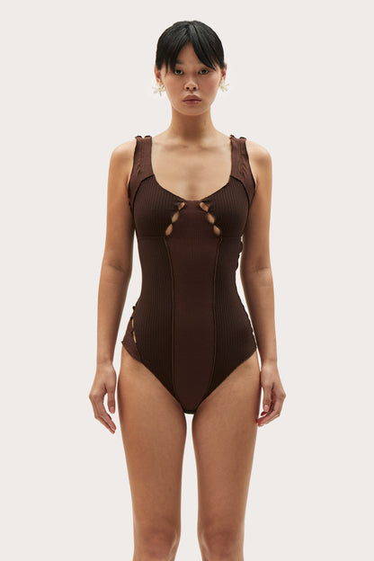 Brown wavy-rib bodysuit with scoop neckline and central cutout lace-up at bust